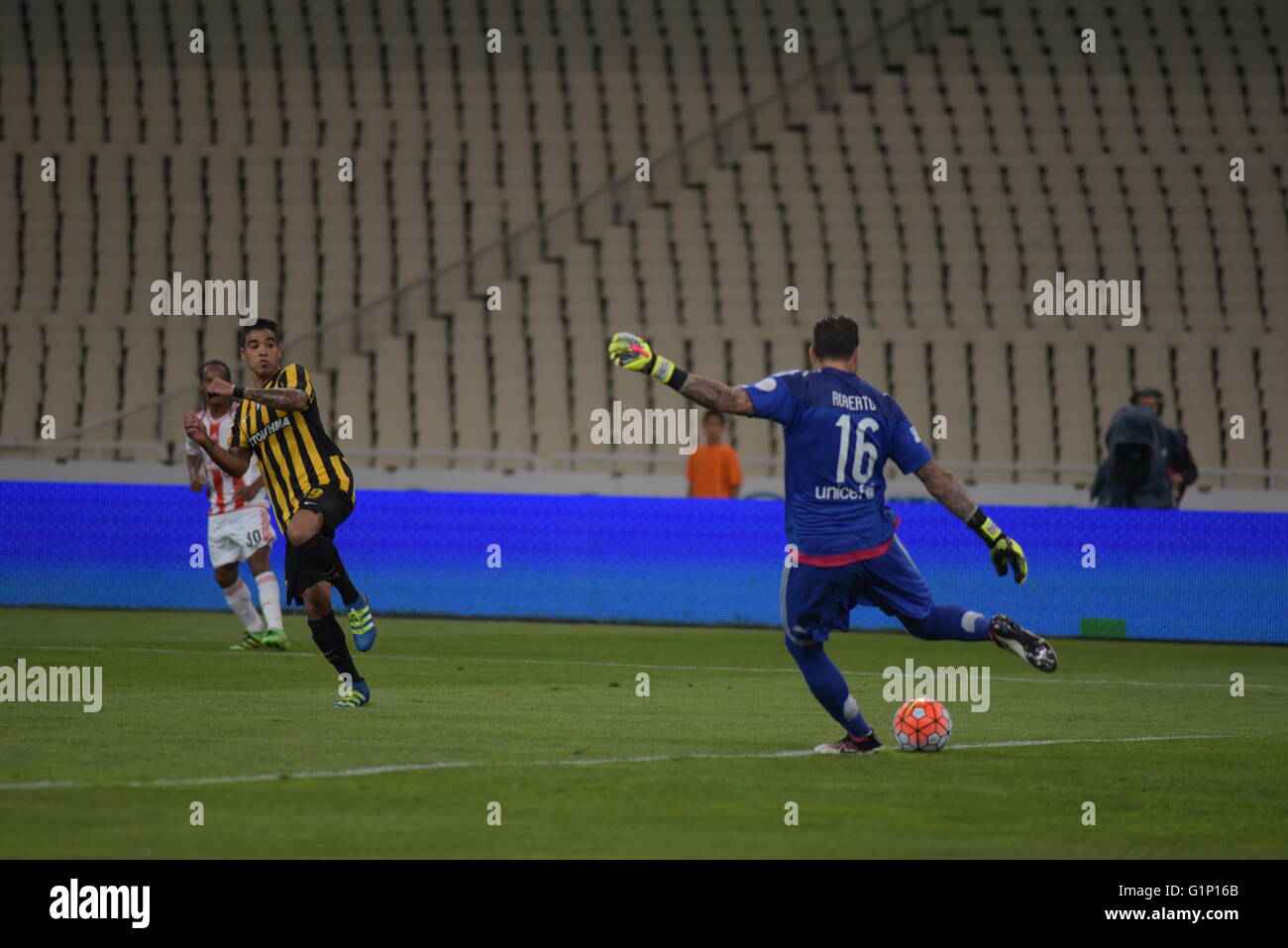 Ronald Vargas of AEK (left) tries to stop the attempt of the goalkeeper of  Olympiacos Roberto (right) to throw away the ball during Greek Football Cup  Final. AEK beats Olympiacos, 2-1. (Photo