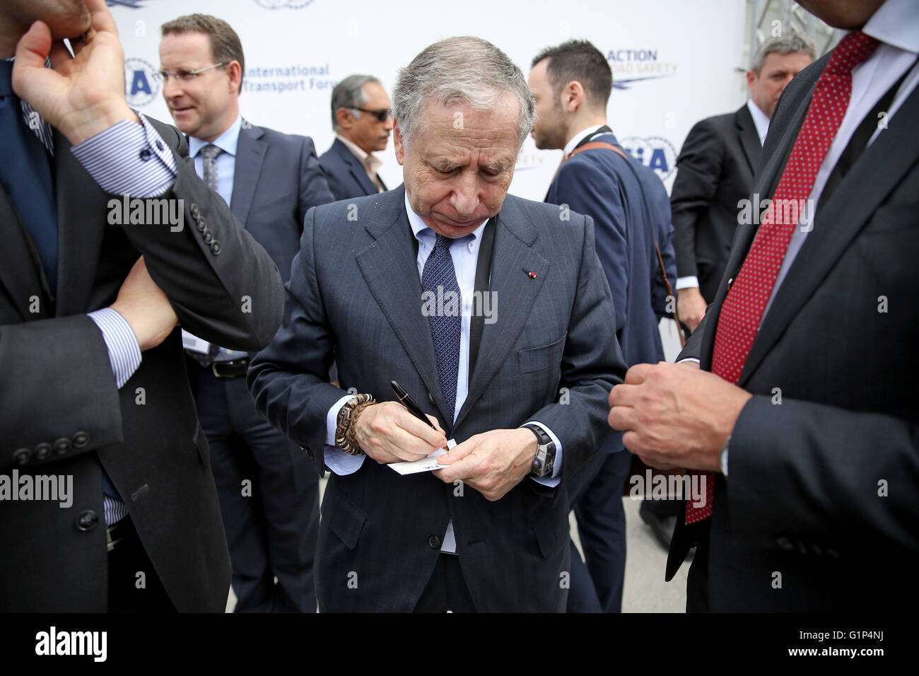 Leipzig, Germany. 18th May, 2016. Jean Todt (C), president of the International Automobile Federation (FIA), seen at the world summit of transport ministers in Leipzig, Germany, 18 May 2016. Some 1,000 participants from 60 countries are expected to attend the three-day summit held by the International Transport Forum of the Organisation for Economic Co-operation and Development (OECD). Photo: JAN WOITAS/dpa/Alamy Live News Stock Photo