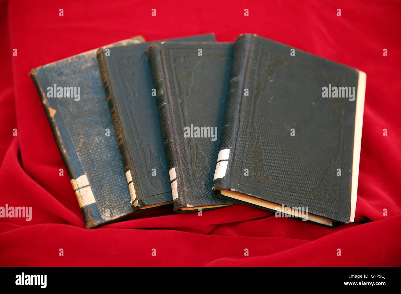 Rostock, Germany. 18th May, 2016. Stolen books from the inventory of the Rostock university library seen at the restitution ceremony to heiress Audrey Goodman of the USA, in Rostock, Germany, 18 May 2016. A project supported by the German Lost Art Foundation was launched to locate the German Nazi plunder goods. The nine books were wrongfully seized by the Nazis and subsequently exchanged or donated to the Rostock university library. Photo: BERND WUESTNECK/dpa/Alamy Live News Stock Photo