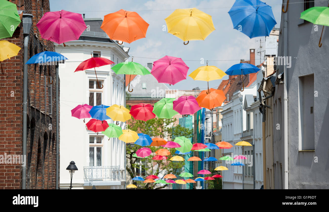 Luebeck, Germany. 18th May, 2016. Colourful umbrellas hanging in an