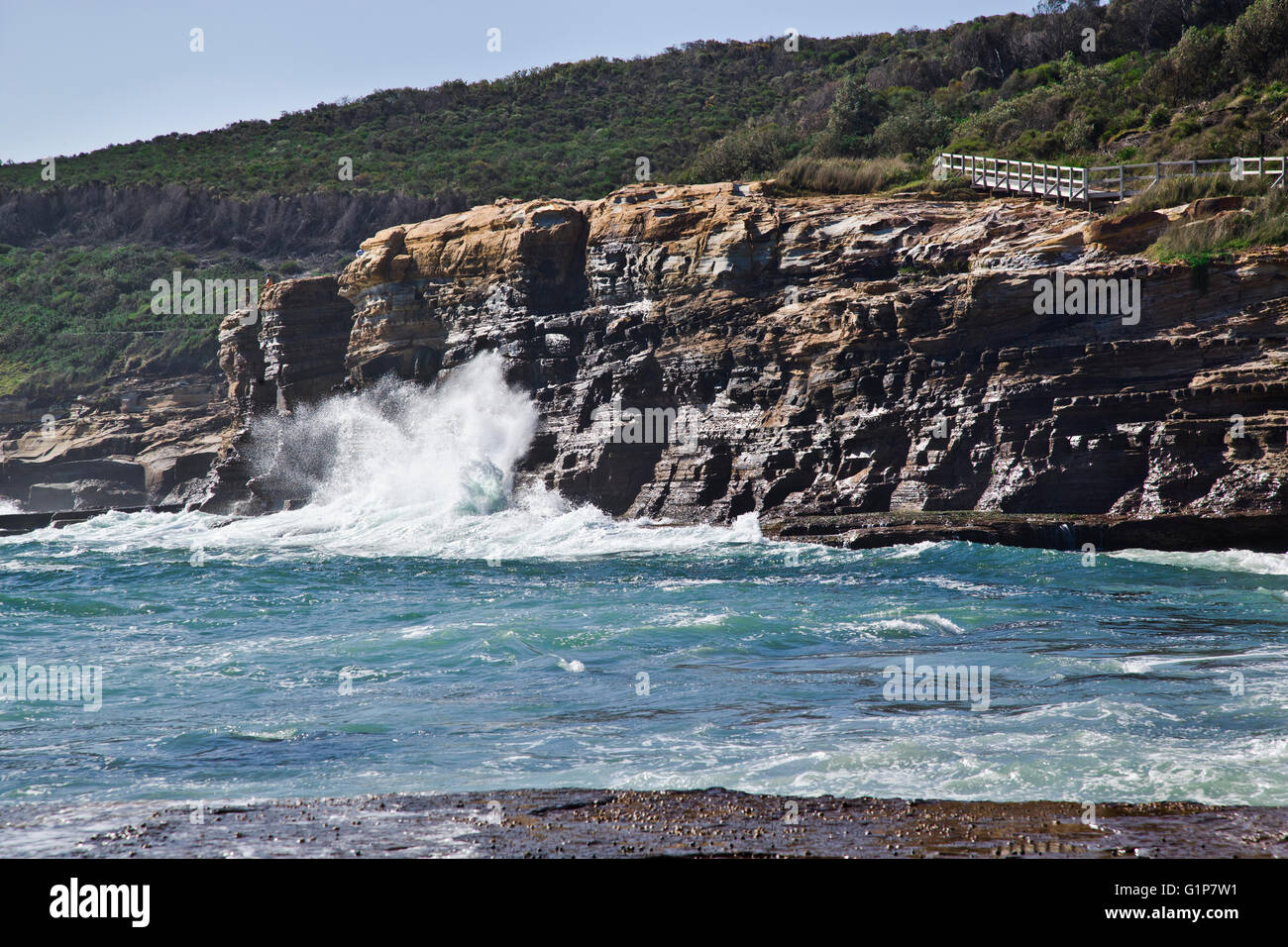 Australia, New South Wales, Central Coast, Bouddi National Park, pounding surf on a rock face of the Bouddi Peninsula coast Stock Photo
