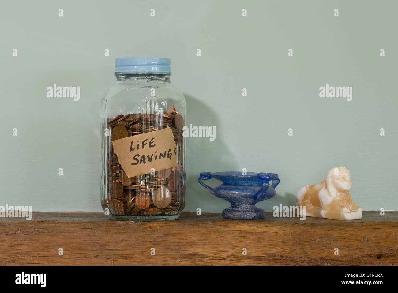A glass jar used to save money Stock Photo Alamy