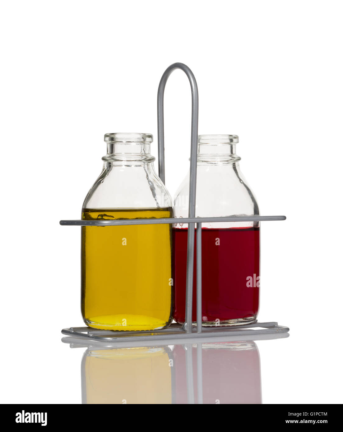 Oil and vinegar bottles in a rack Stock Photo