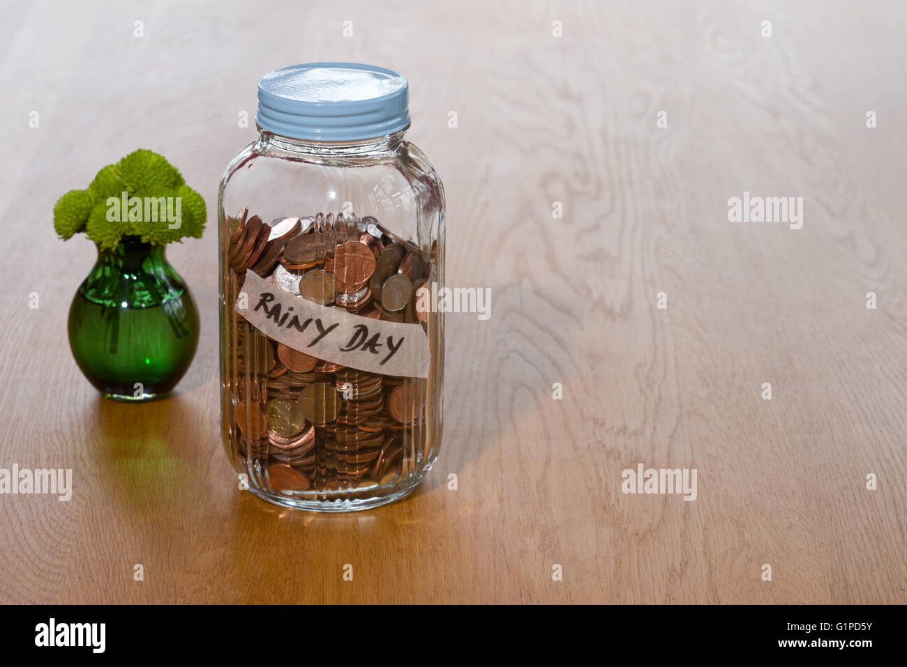 A glass jar used to save money Stock Photo Alamy