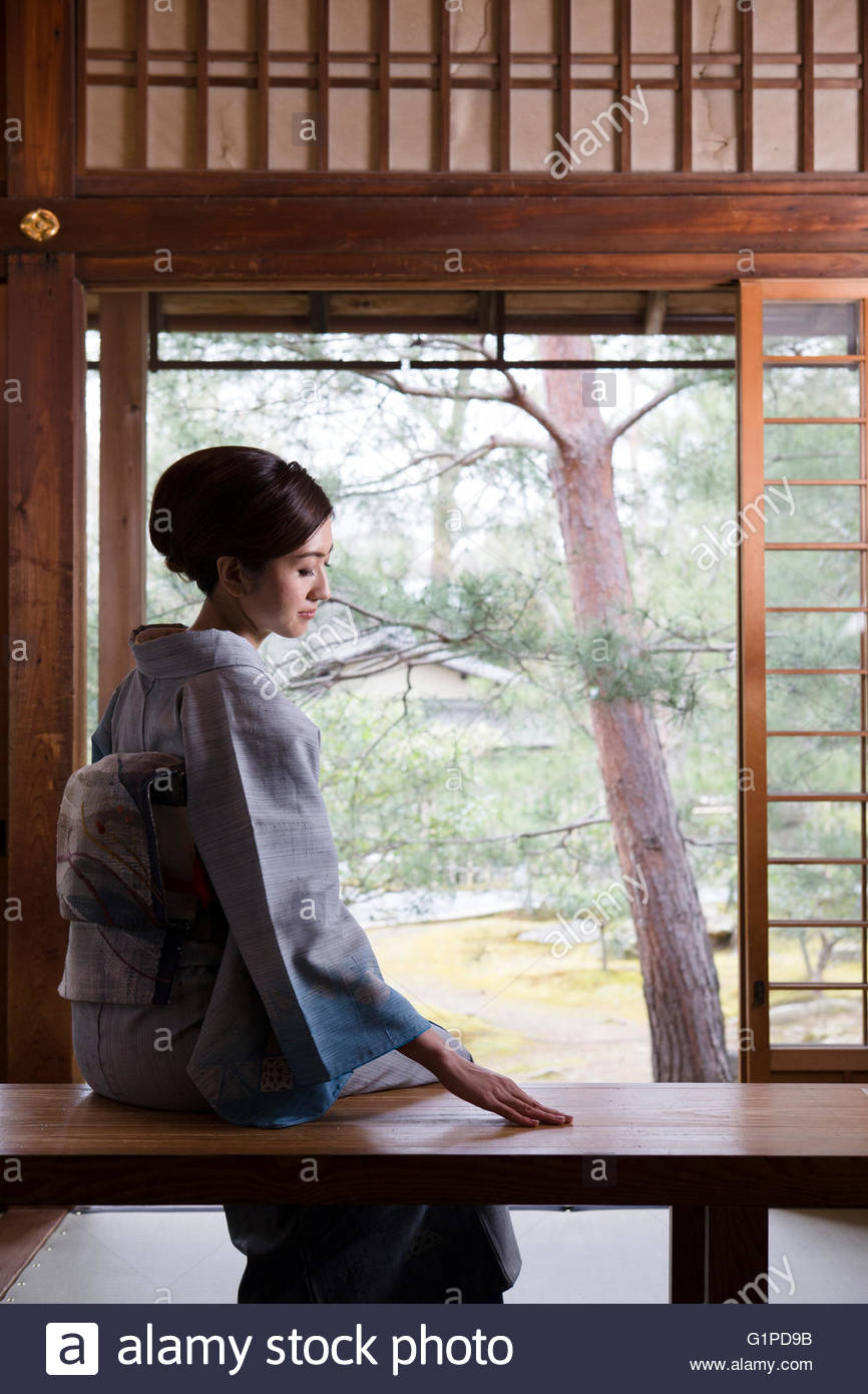 Young Woman In Kimono Sitting High Resolution Stock Photography and