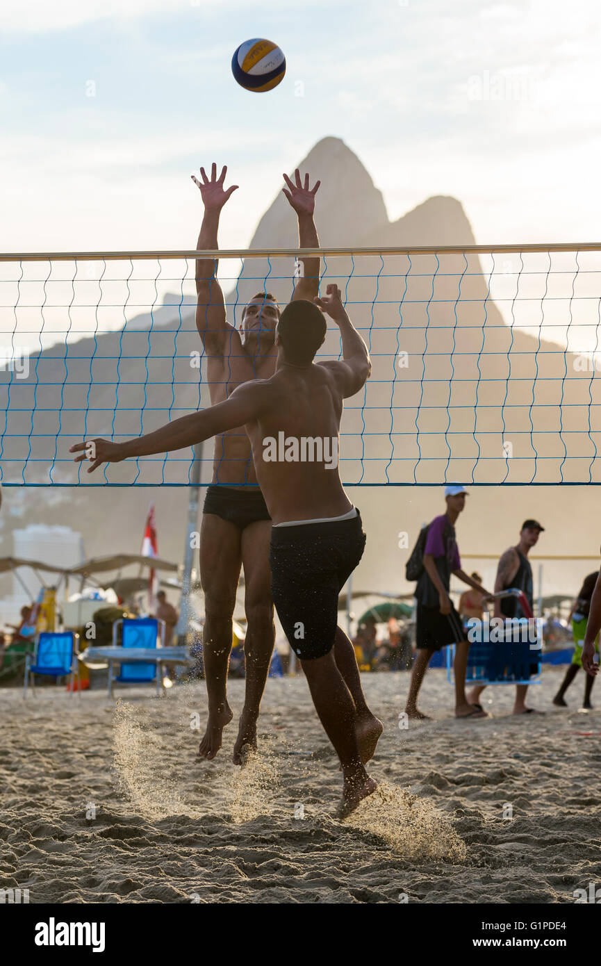 RIO DE JANEIRO - MARCH 20, 2016: Young Brazilians play beach volleyball, a sport Brazil is favored to win in the Olympic Games Stock Photo