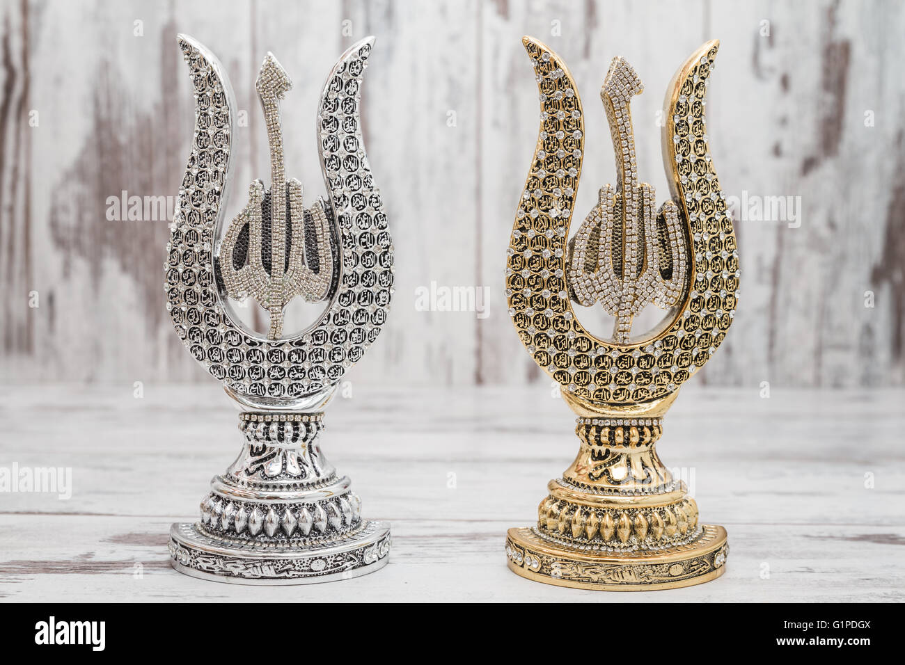 Silver and Golden Religious statuettes with the names of Allah, the God