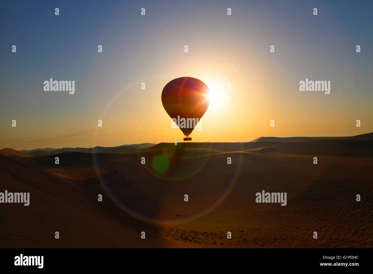 Hot air balloon at sunset.Fly over Dubai desert Stock Photo