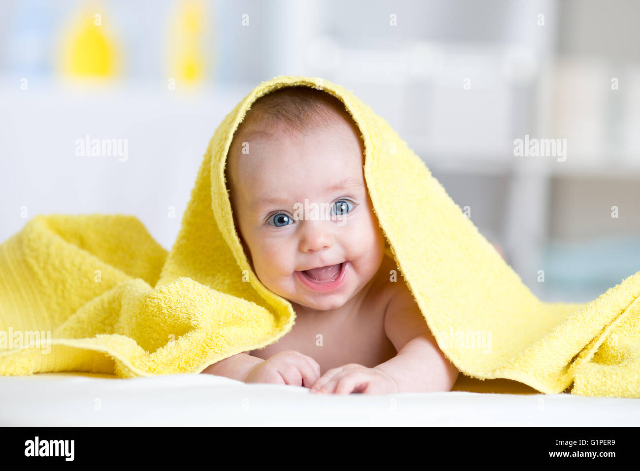 Cute smiling baby after shower or bathing Stock Photo