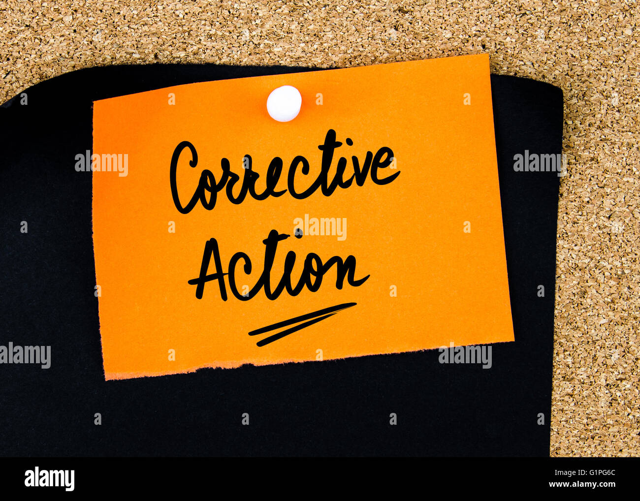 Corrective Action written on orange paper note pinned on cork board with white thumbtacks, copy space available Stock Photo