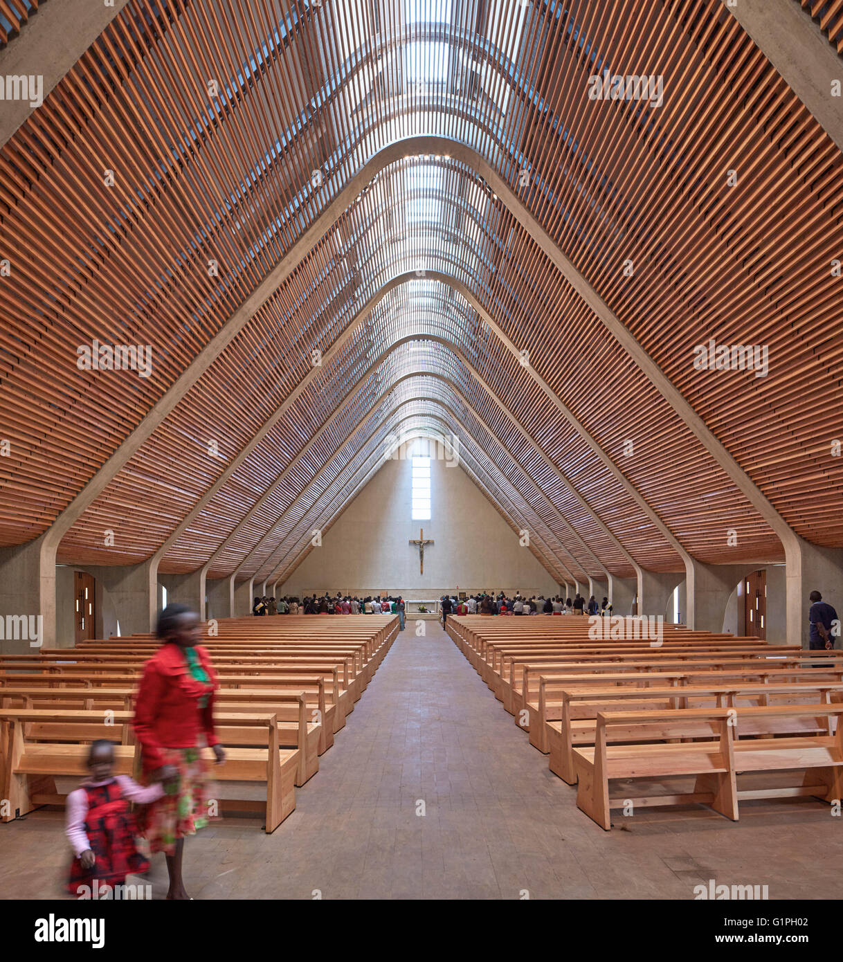 Cathedral interior during late mass. Sacred Heart Cathedral Of The Catholic Diocese Of Kericho, Kericho, Kenya. Architect: John Stock Photo
