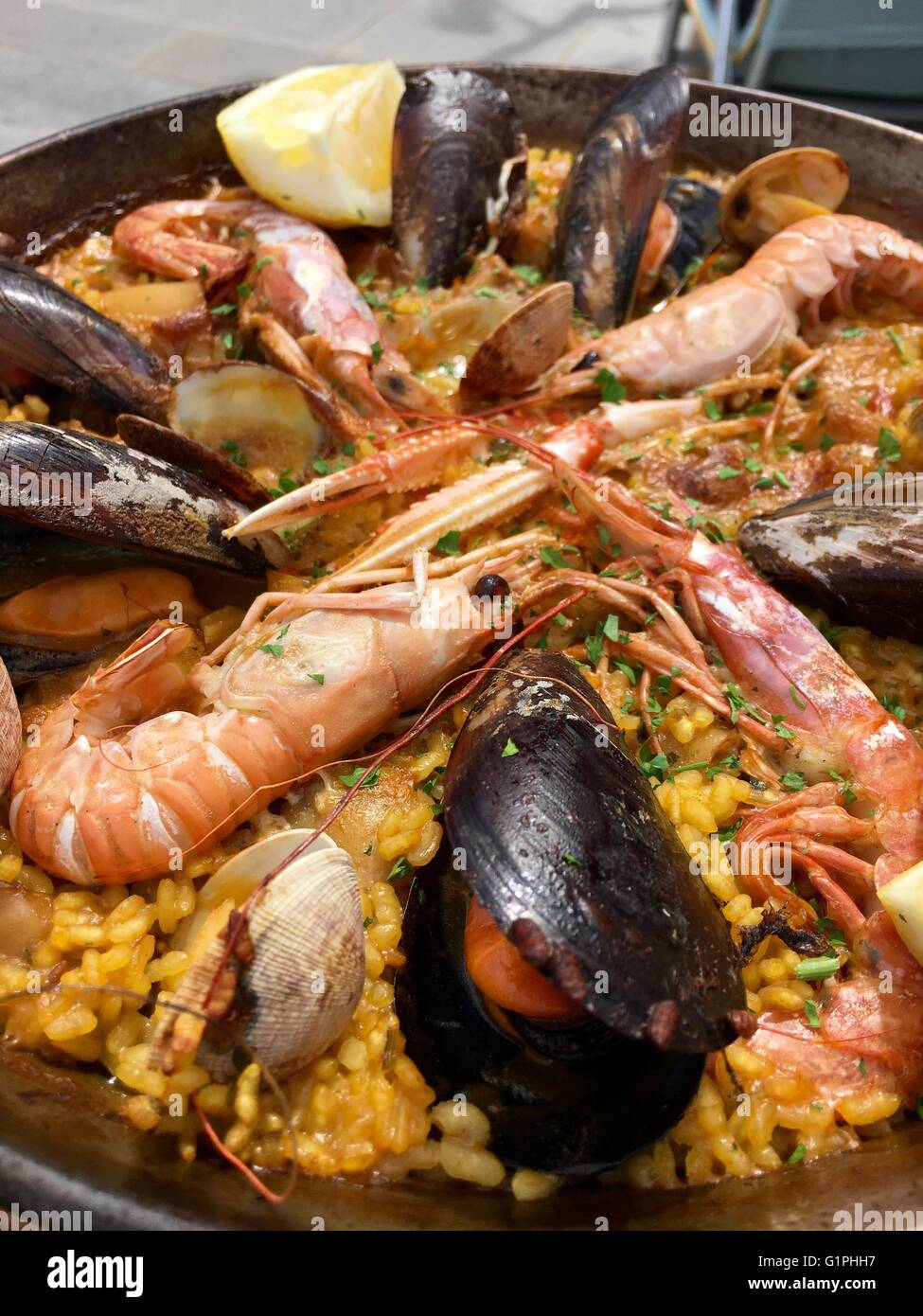A traditional Spanish Seafood Paella dish with an assortment of fish