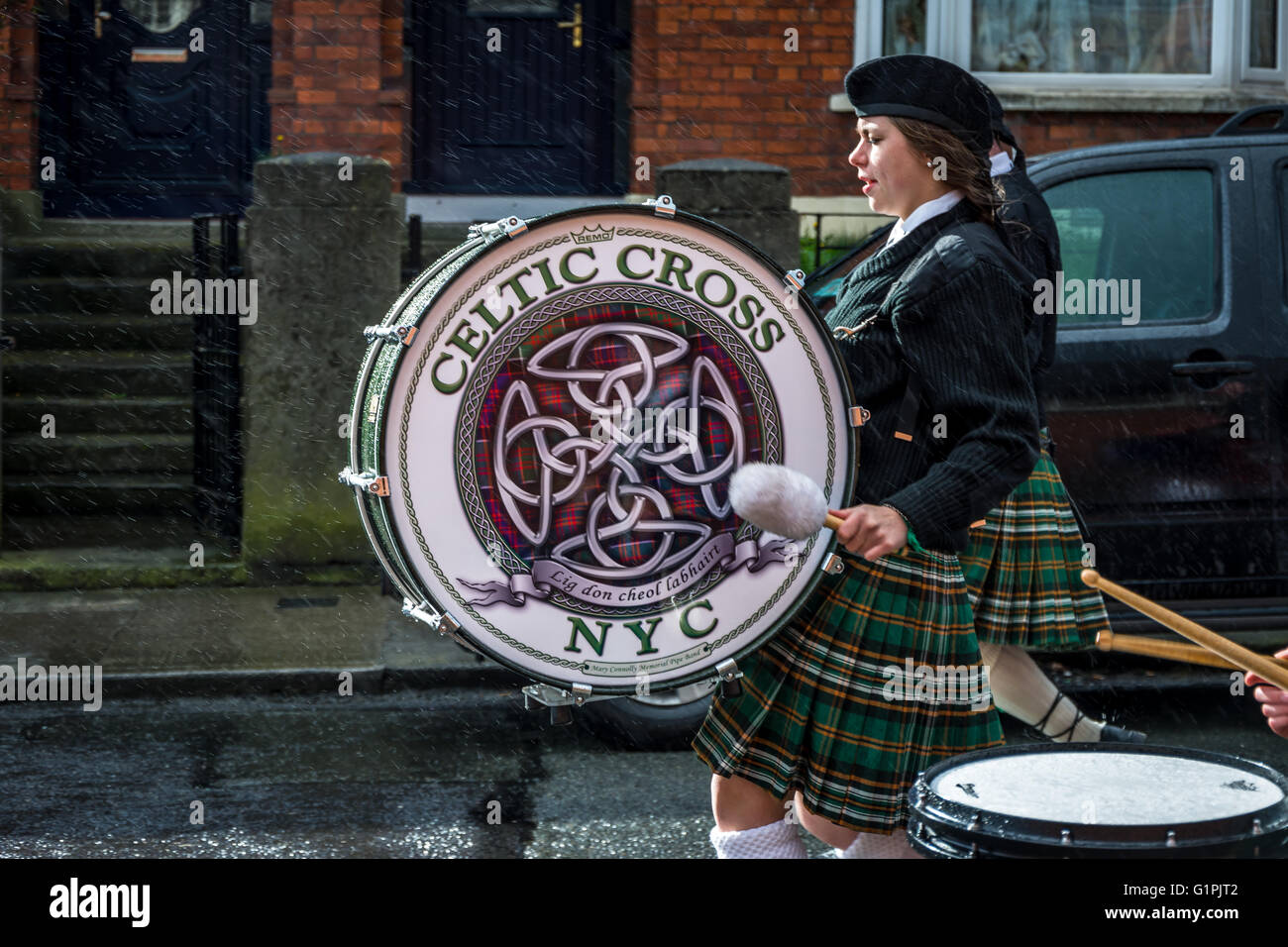 Irish American Pipe Band member parading through Arbour HIll in Dublin as part of 1916 Easter Rising centenary events. Stock Photo