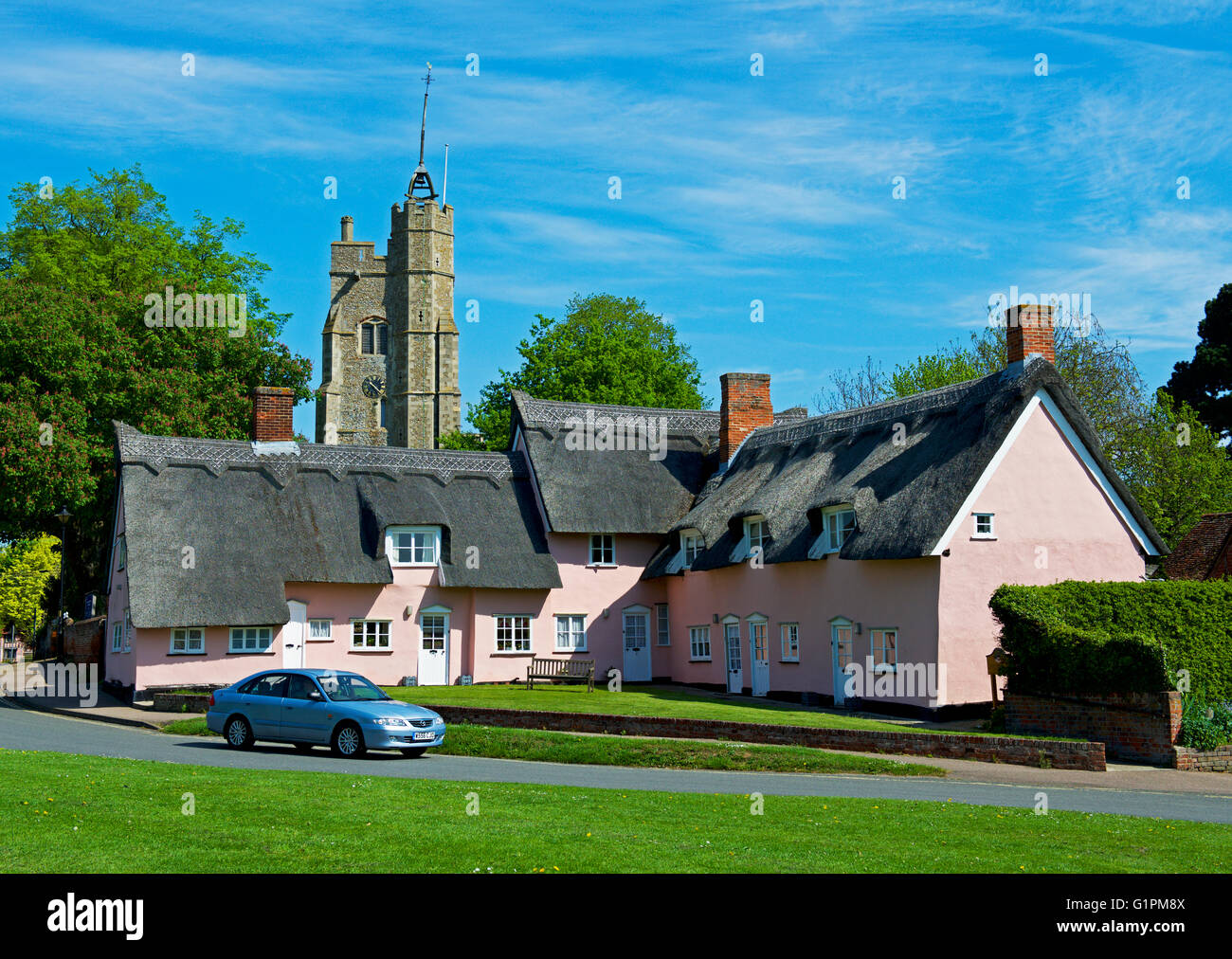 Almshouses and St Mary's church, in the village of Cavendish, Suffolk