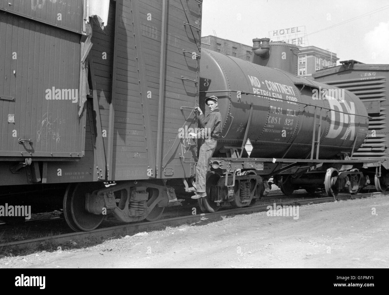 RAILROAD, 1940. A boy hopping a freight train in Dubuque, Iowa