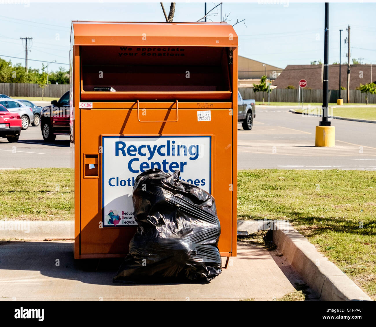 A clothing recycling center bin in Oklahoma City, Oklahoma, USA Stock