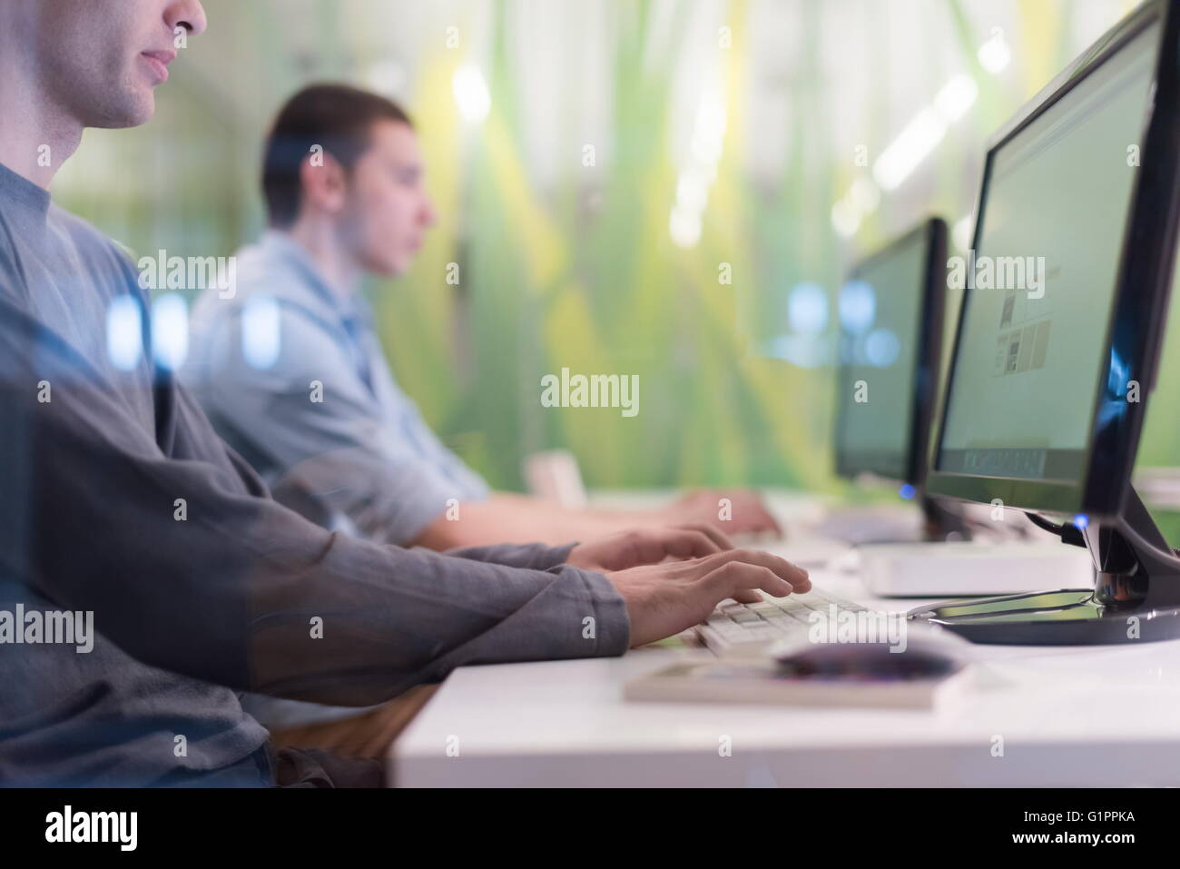 technology students group in computer lab school classroom working on ...