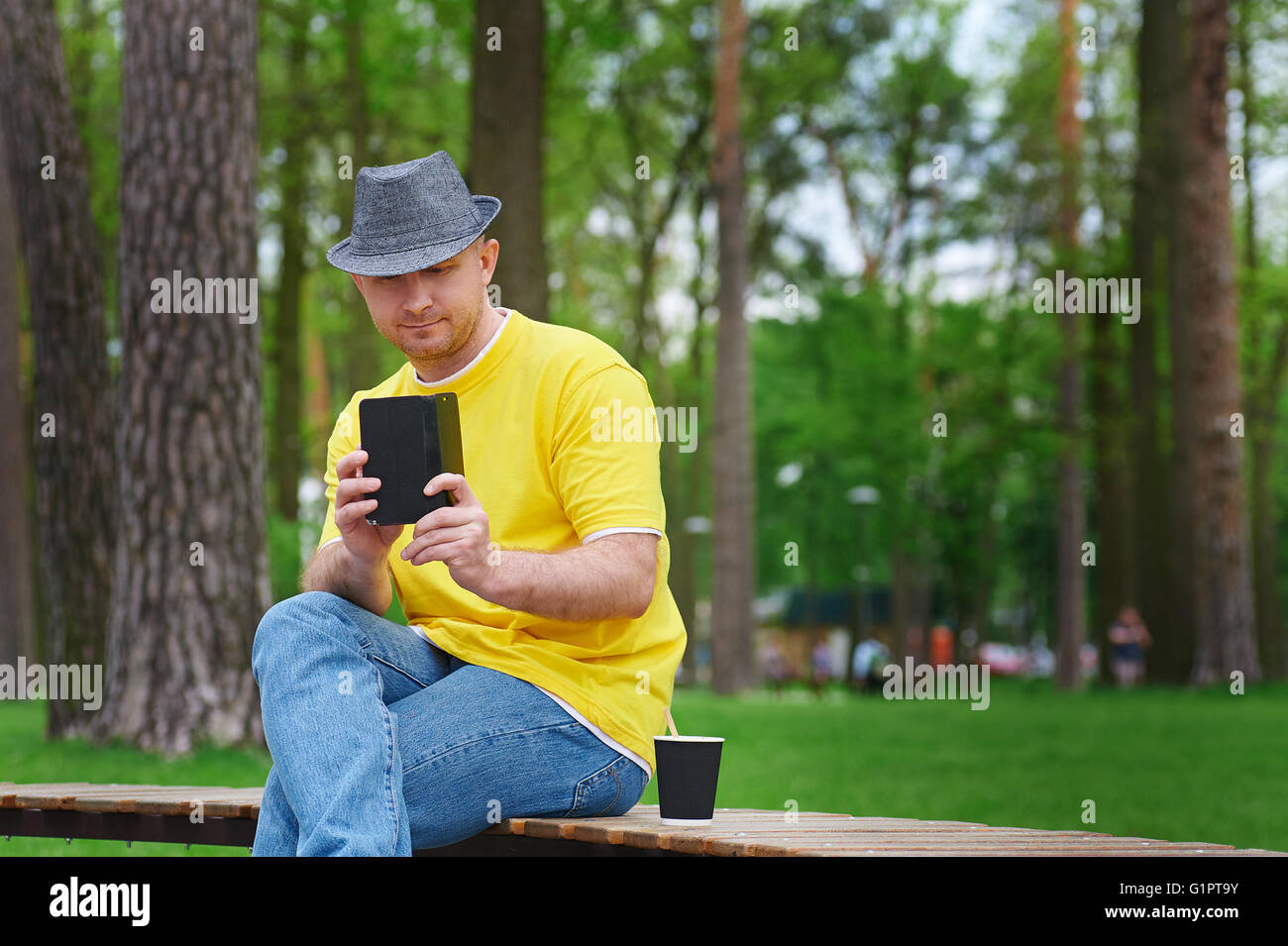 Beard man sitting on bench hi-res stock photography and images - Alamy