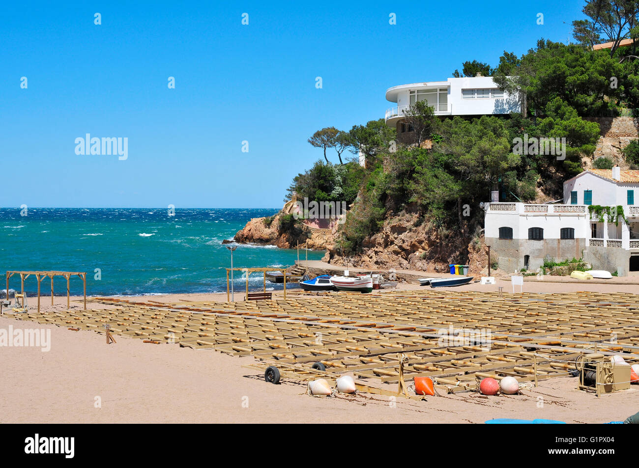 fishing boats at the Sa Riera beach in Begur, in the Costa Brava ...