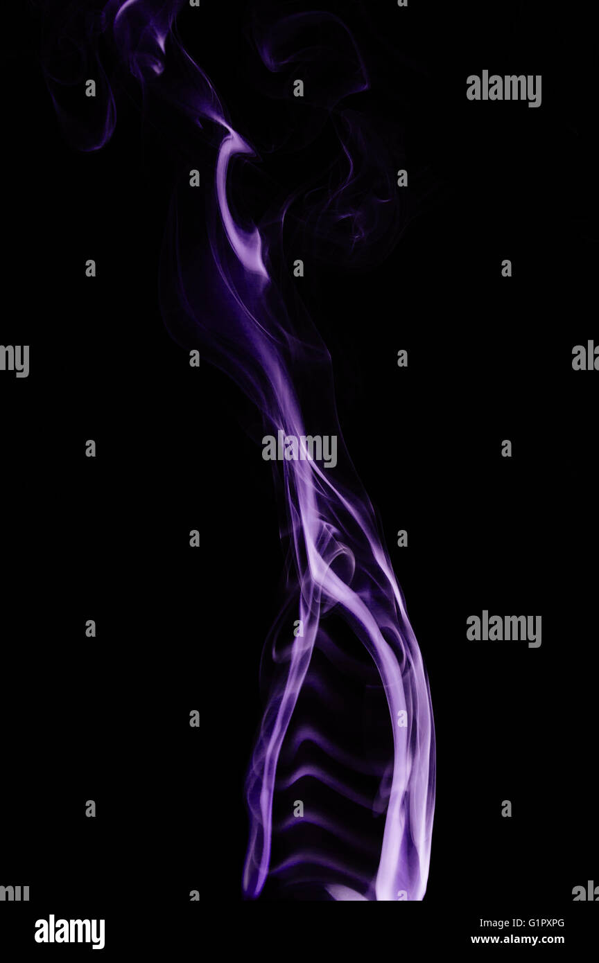 Capturing the smoke from an incense stick and changing the colour Stock