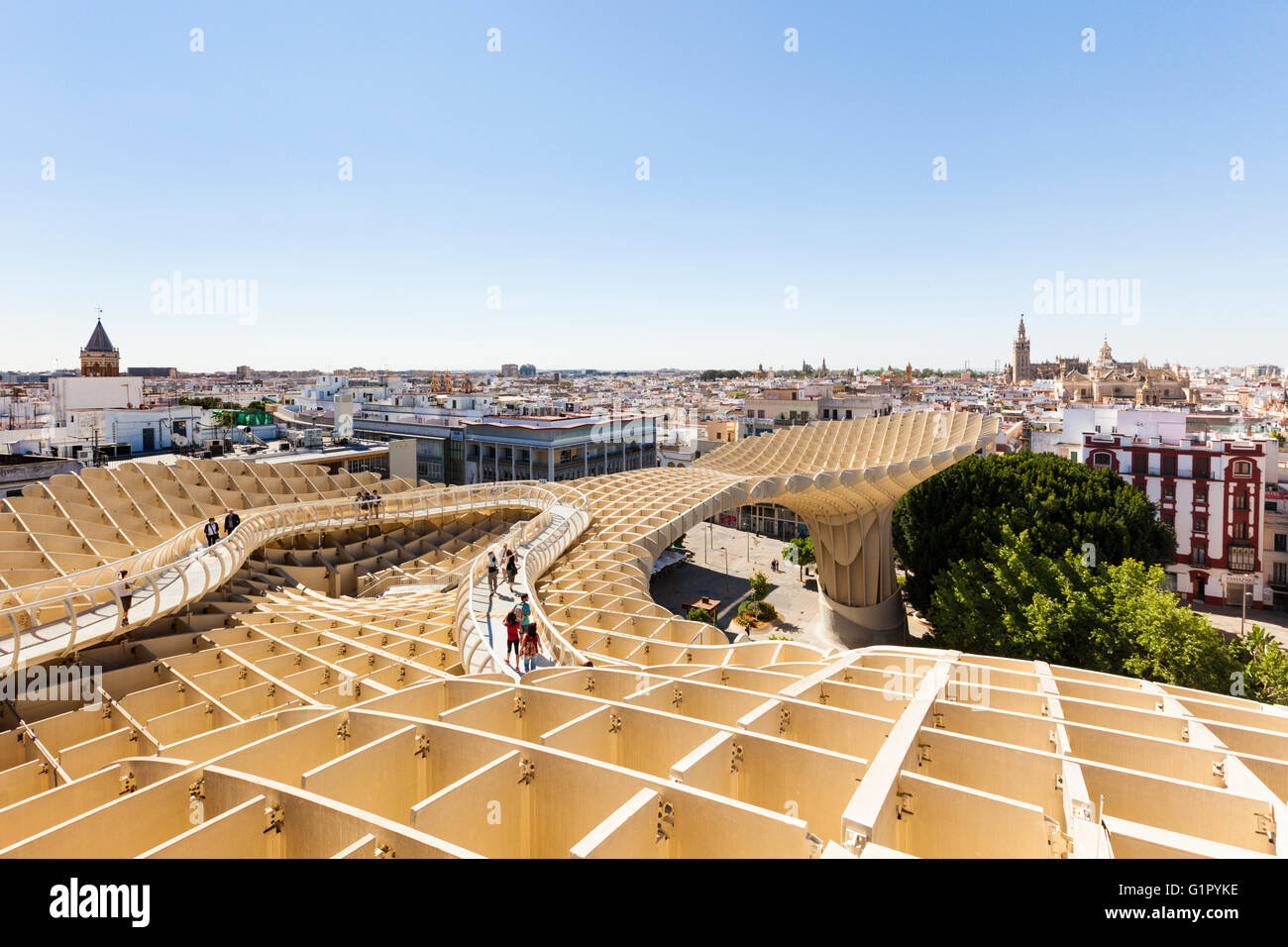 Tourists visiting the lookout on Metropol Parasol building at Seville, Spain, enjoying the view over the city Stock Photo