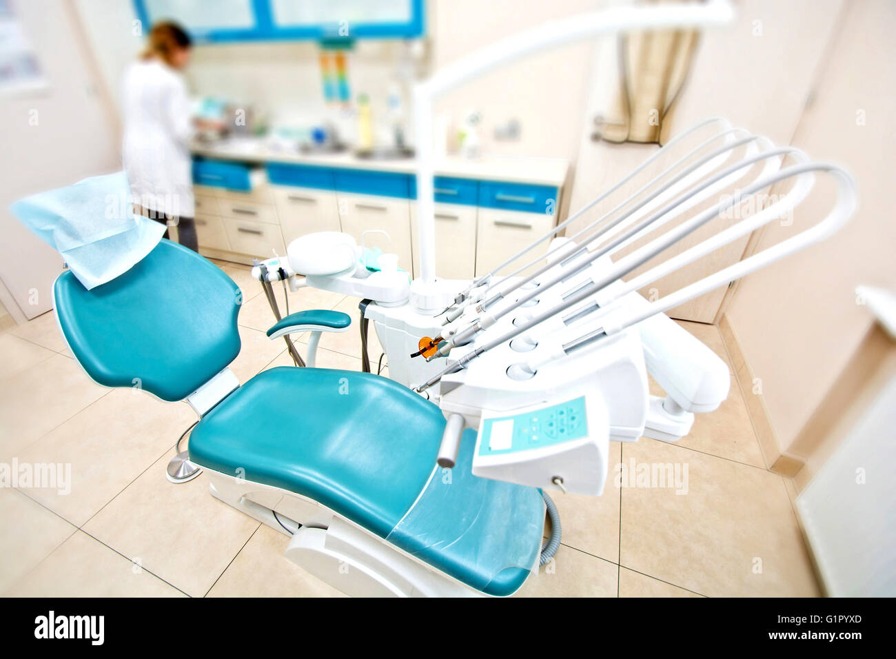 Professional Dentist tools and chair in the dental office. Dental