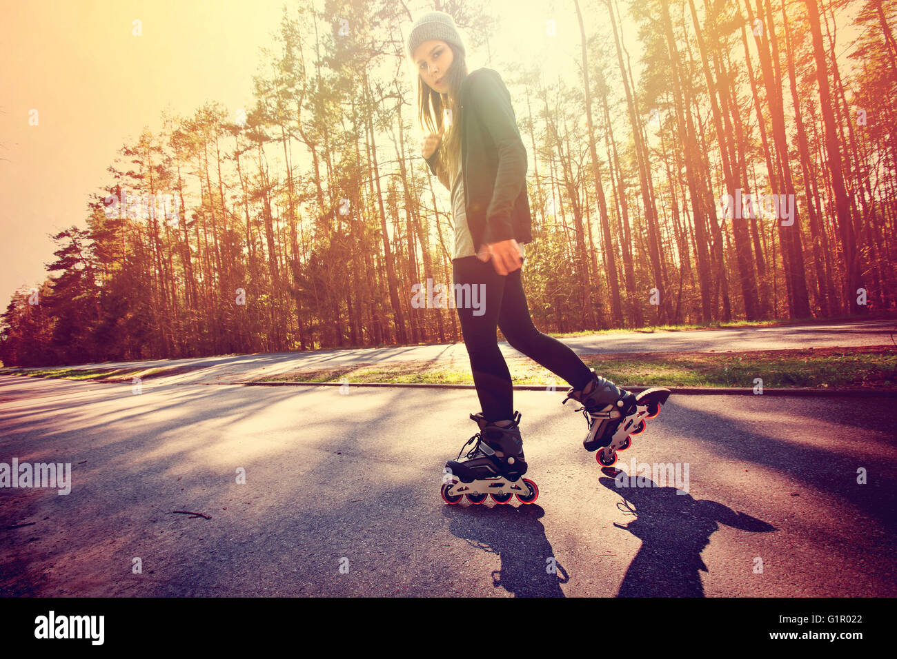 Teenage girl on roller skates at summer. Inline skates sport conceptual  image Stock Photo - Alamy