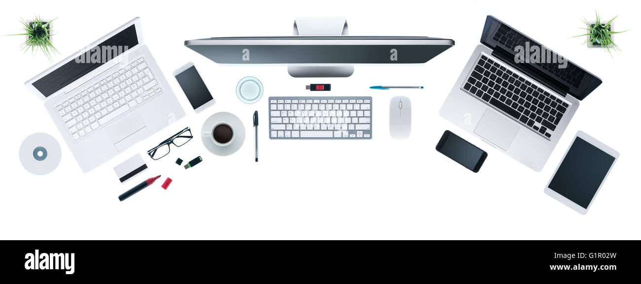 Hi-tech business desktop with computers set, digital tablet and smartphone, information technology and multiplatform concept, to Stock Photo