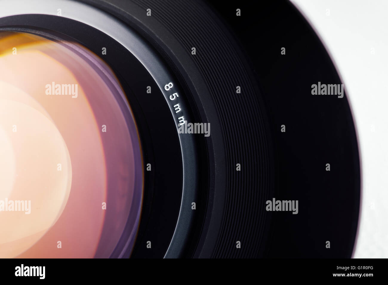 Professional digital camera lens close up on white background Stock