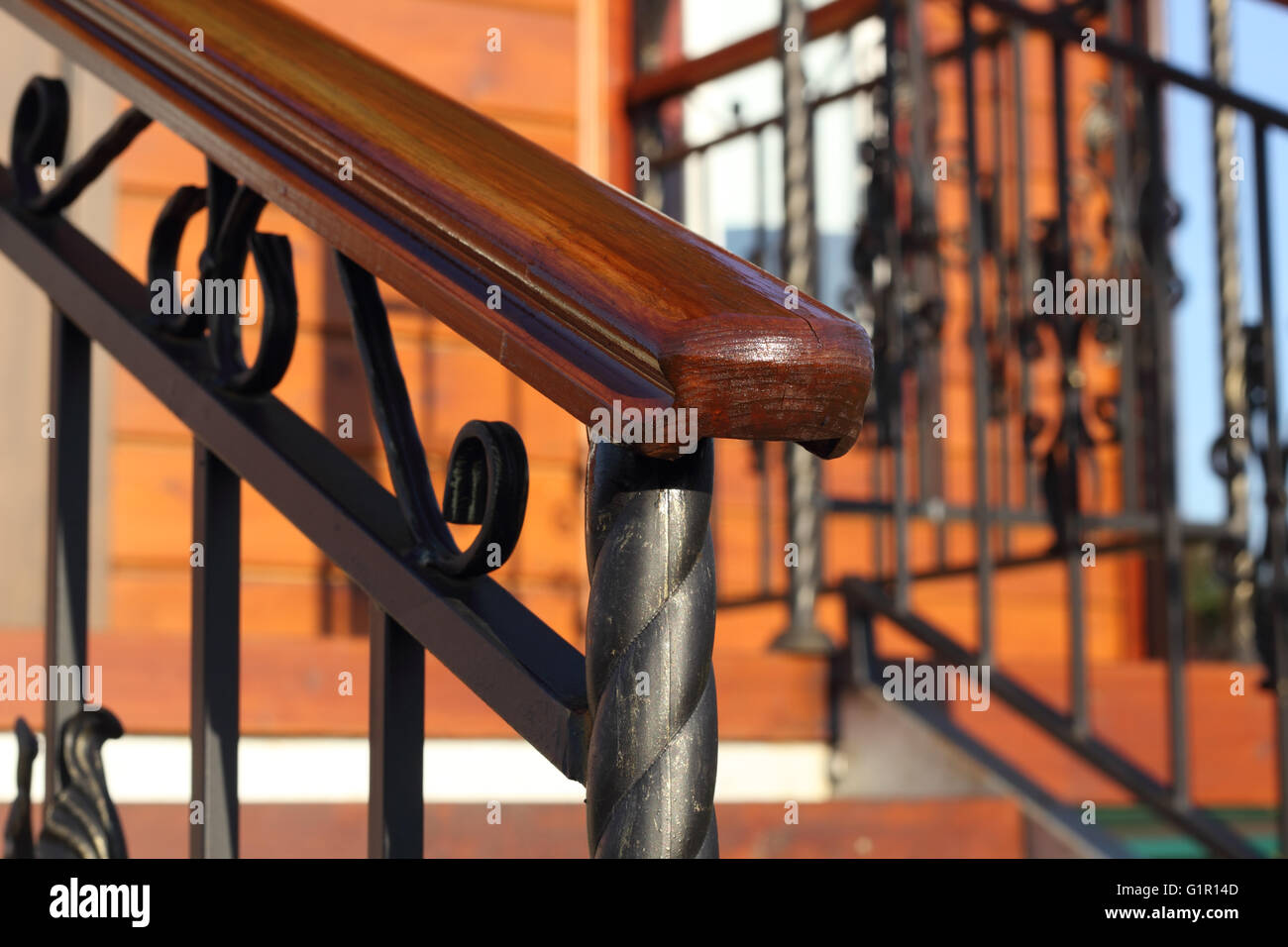 Wooden hand-rail close-up partially defocused diagonal photo Stock Photo