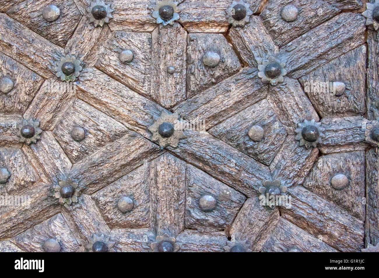 Details of a carved wooden door with ornaments in Stone Town of Zanzibar, Tanzania Stock Photo