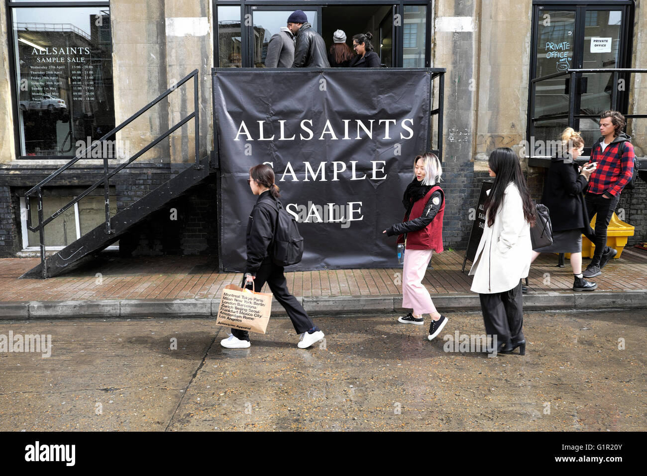 People shopping at ALLSAINTS sample sale in Shoreditch warehouse London UK  KATHY DEWITT Stock Photo - Alamy