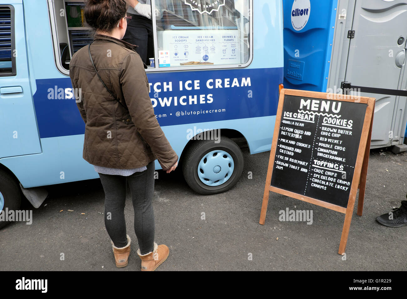 Young woman buying artisan ice cream from a street market in Maltby Street  Market in Bermondsey, South London UK KATHY DEWITT Stock Photo - Alamy