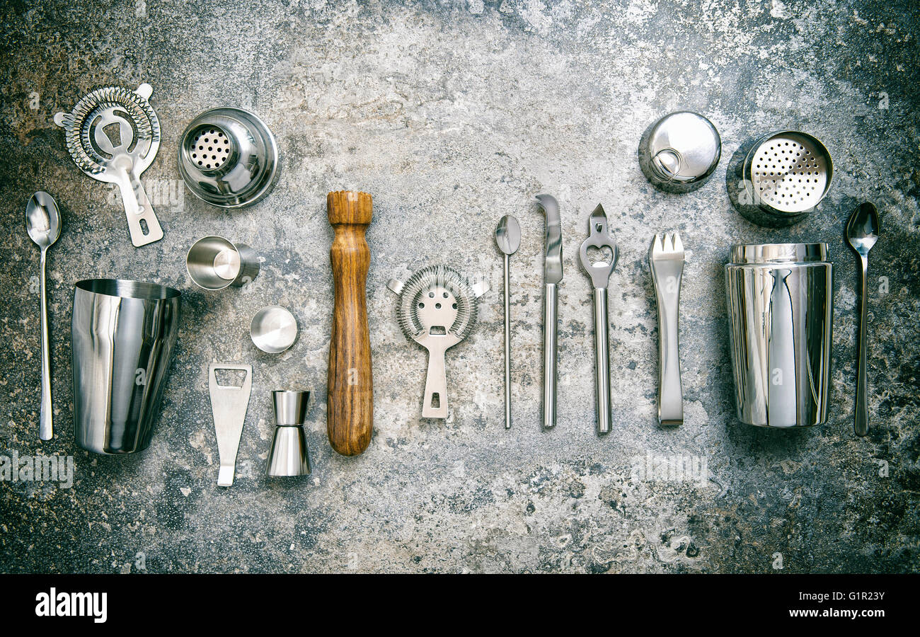 Bar tools for making cocktail. Shaker, jigger, strainer, spoon. Vintage style toned picture Stock Photo