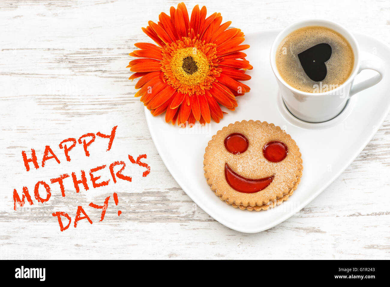Black coffee with smiled cookie. Heart, love, flower. Happy Mothers Day! Stock Photo