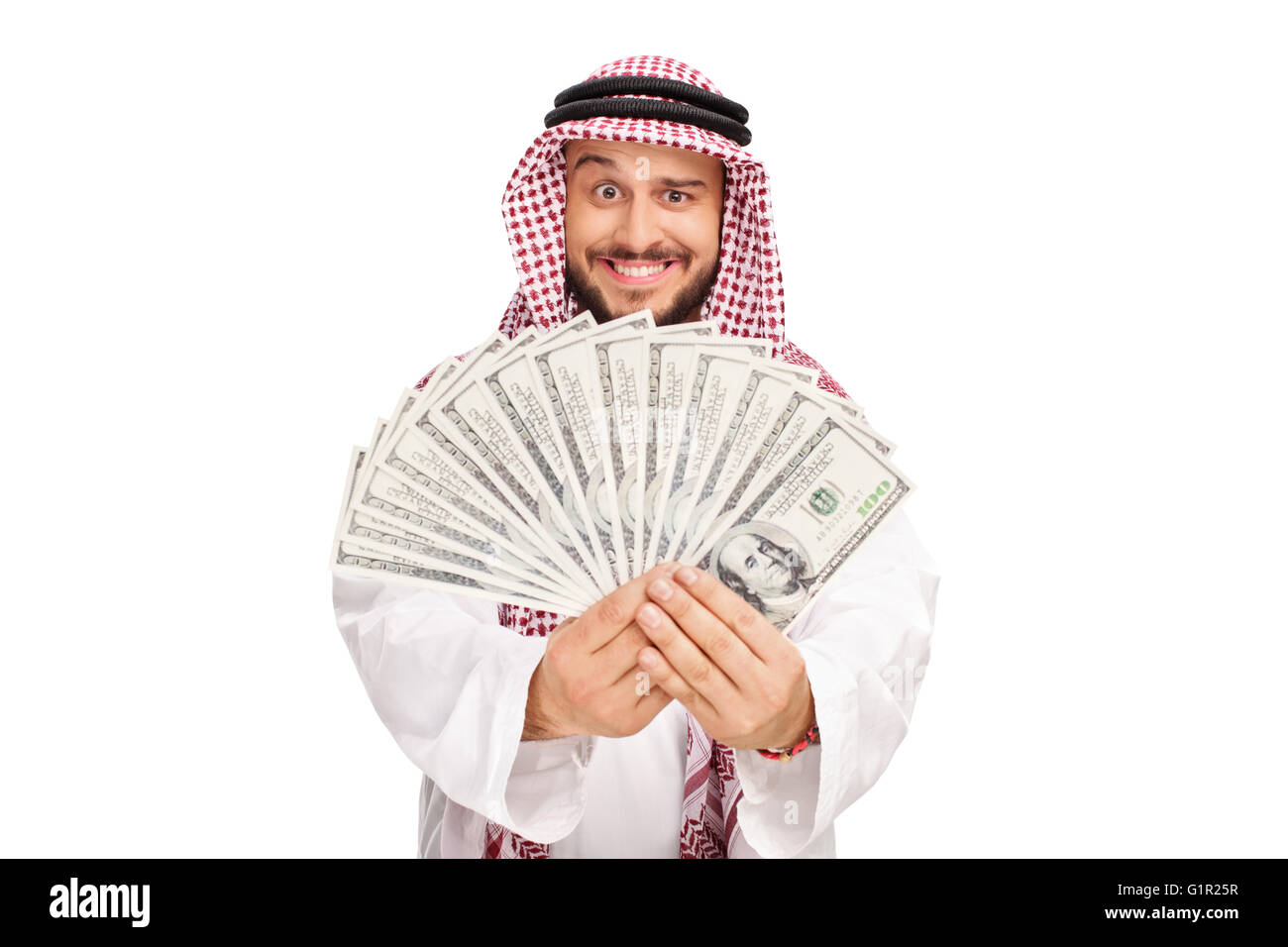 Joyful Arab holding a stack of money isolated on white background Stock Photo