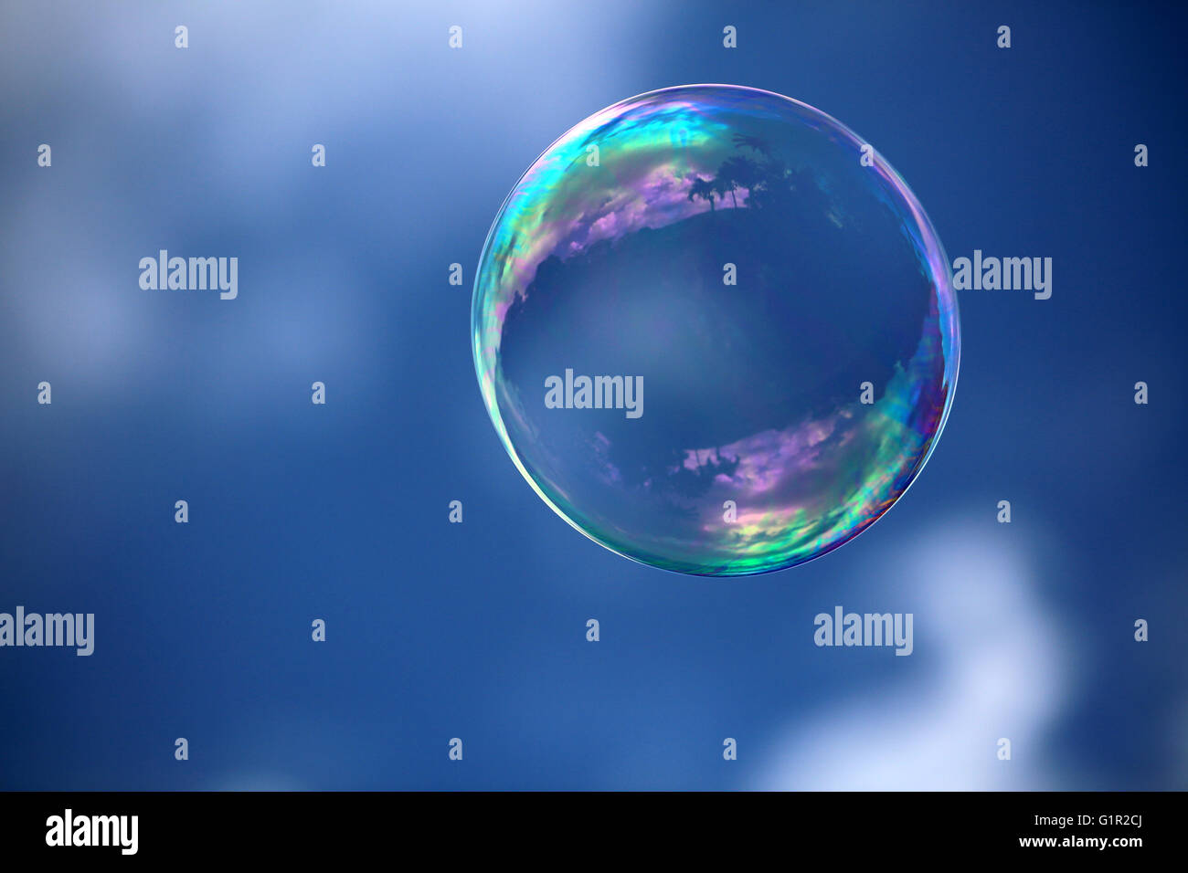 Soap bubble floating in the blue sky Stock Photo - Alamy