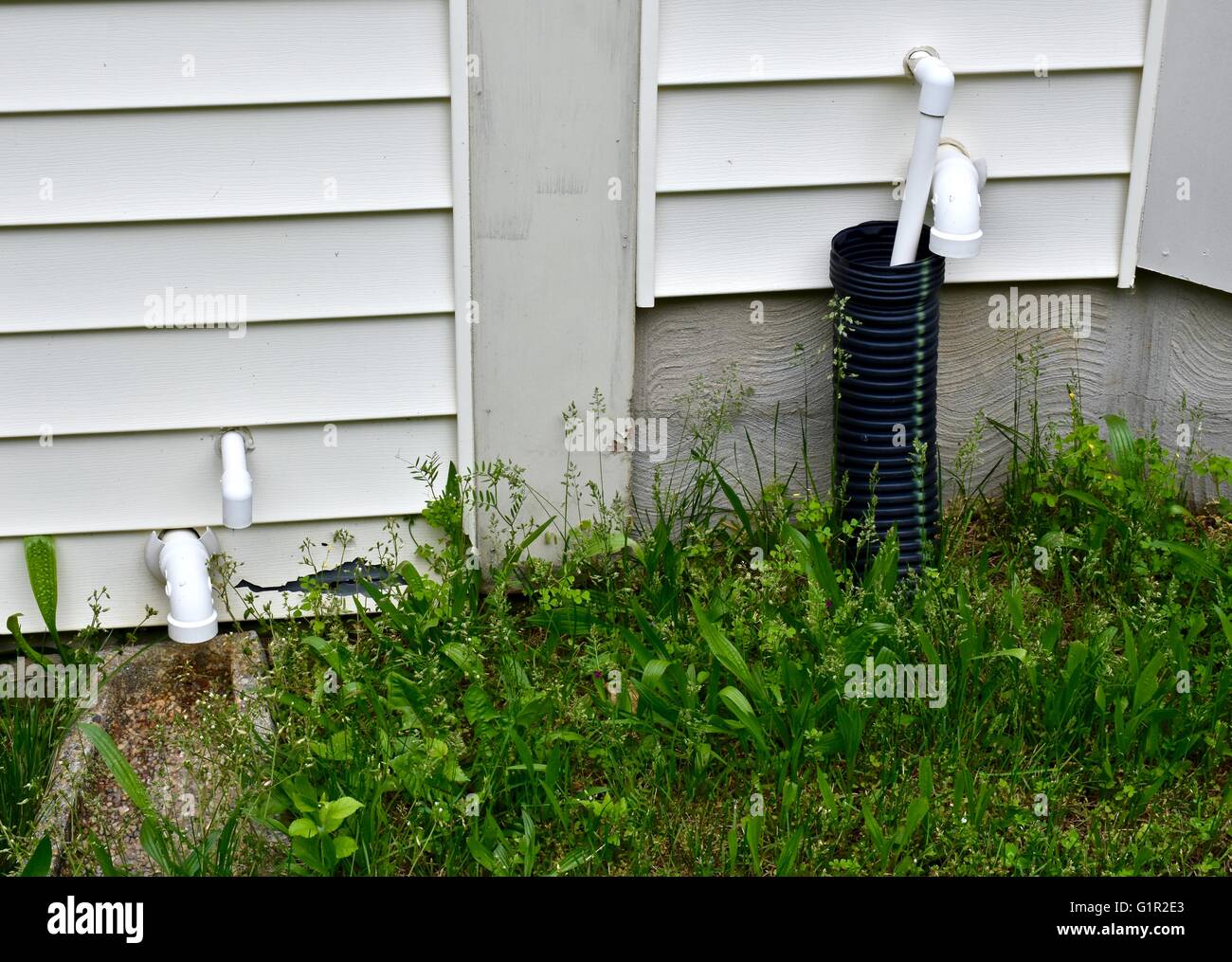 A residential home with a drain pipe on the exterior Stock Photo Alamy