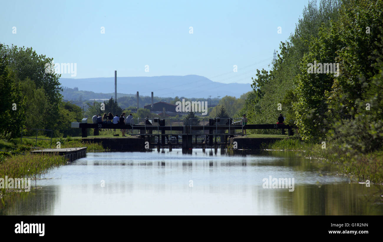 Children on the locks of the Forth and Clyde canal near Clydebank, Glasgow, Scotland, UK. Stock Photo