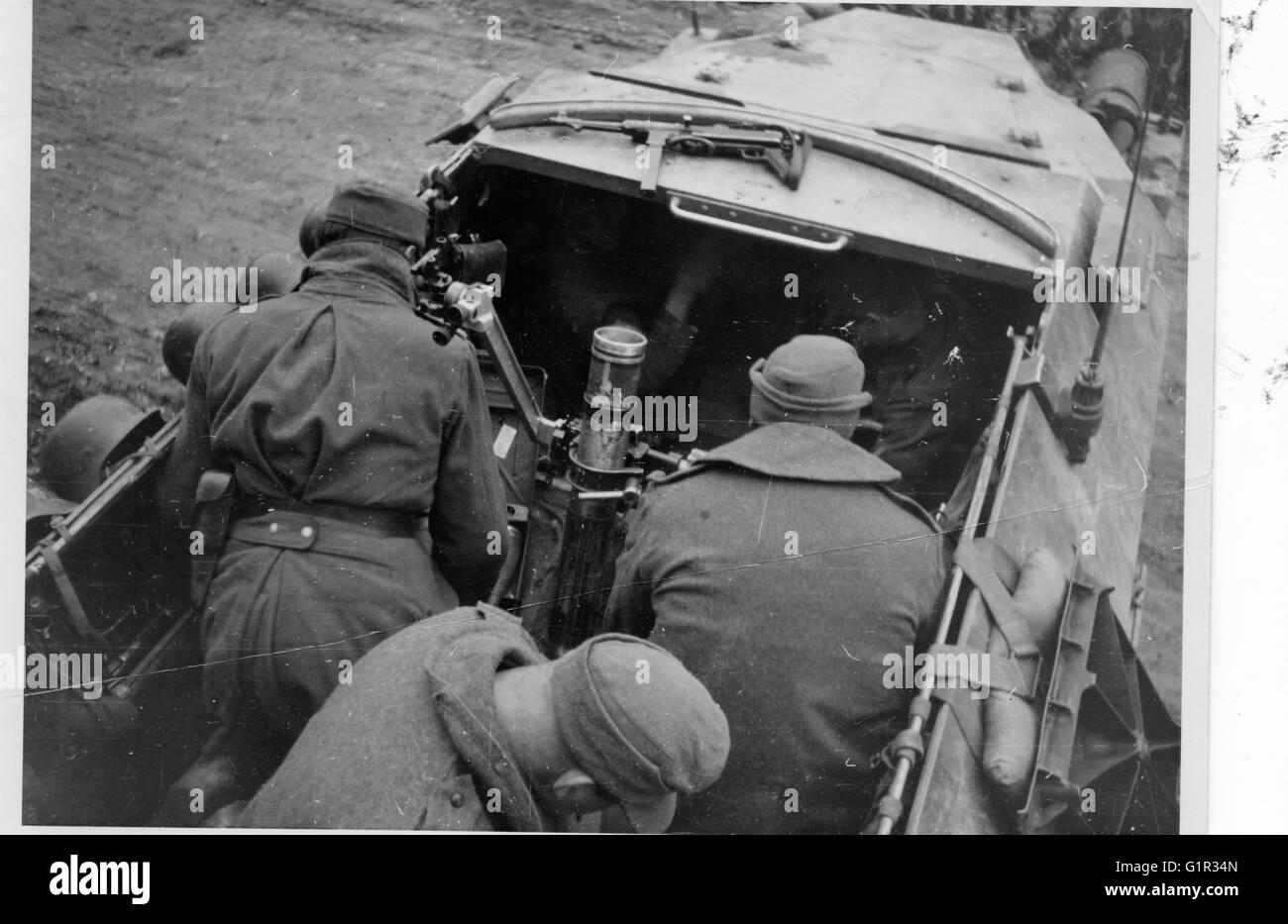Wehrmacht Soldiers fire a Mortar from a Halftrack 251/10 on the Eastern Front 1943 Stock Photo