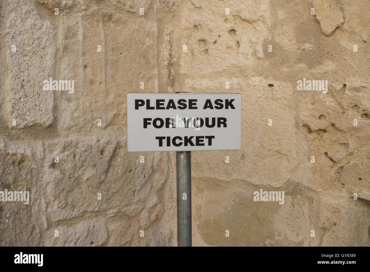 Please ask for your ticket. Stock Photo