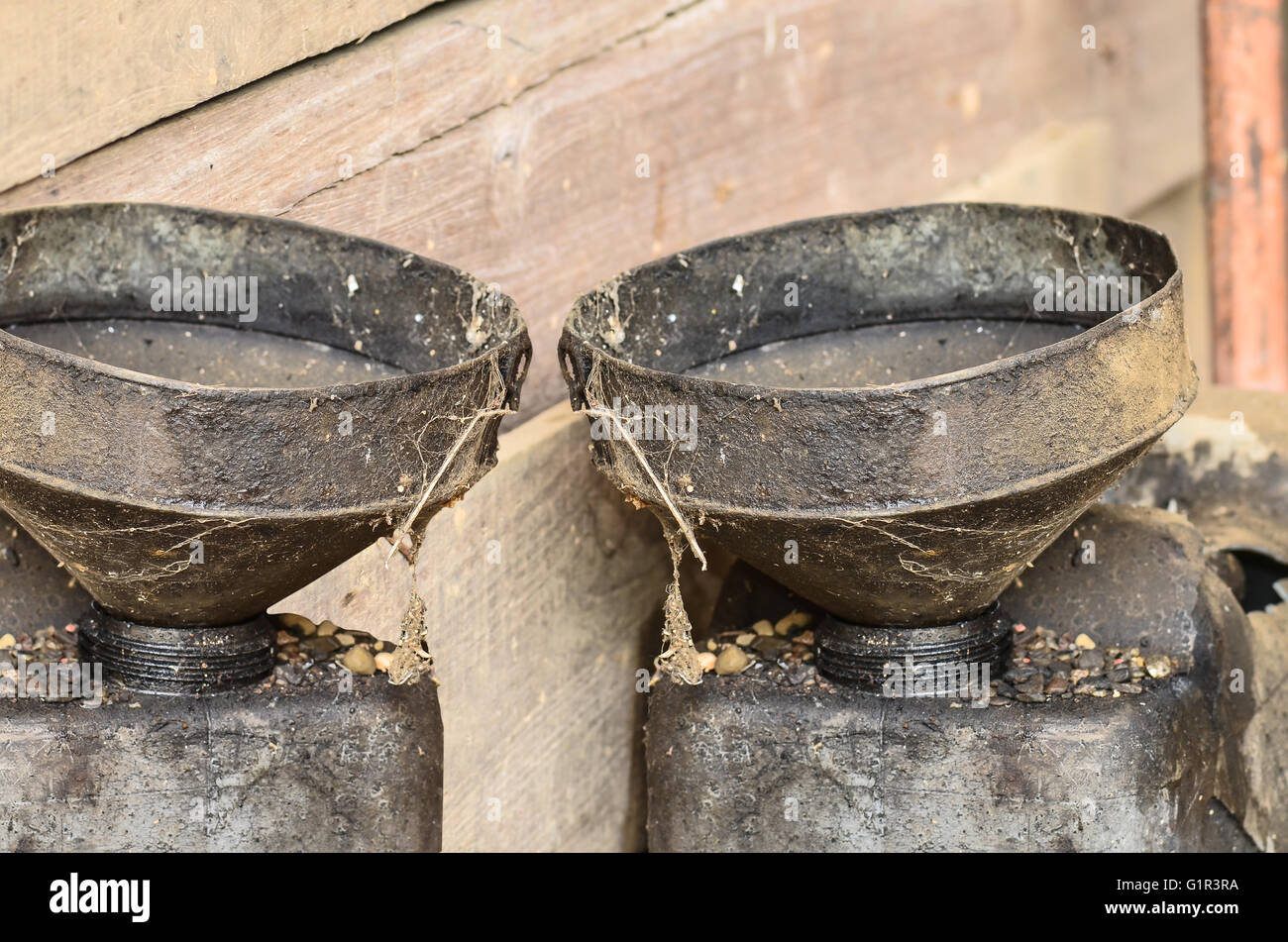 Two Old Oil funnel Stock Photo Alamy