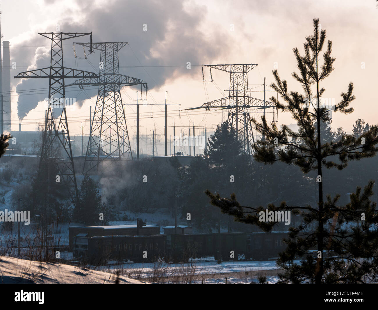 High-voltage power line in a snowy forest, winter landscape Stock Photo ...