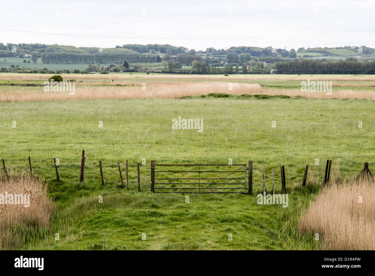 View across Kent farmland towards the North Downs, fence in foreground Stock Photo