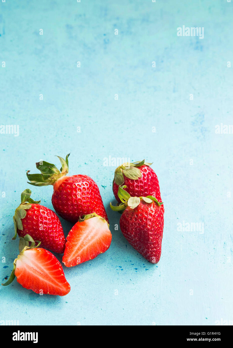 Red ripe strawberries on painted wood Stock Photo - Alamy