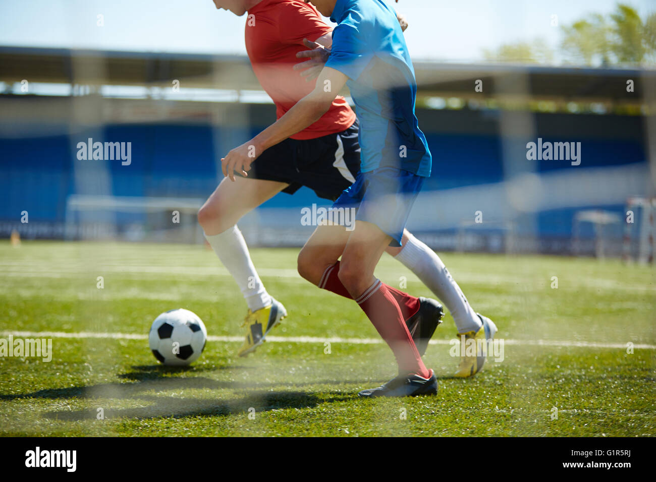 Trying to tackle the ball Stock Photo