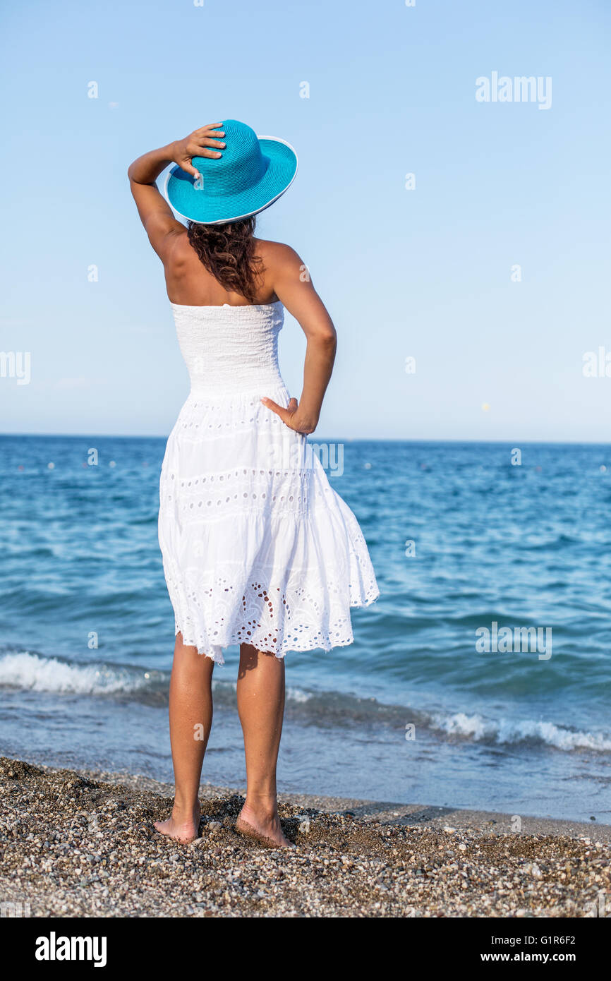 Woman relaxing at the seaside. Stock Photo