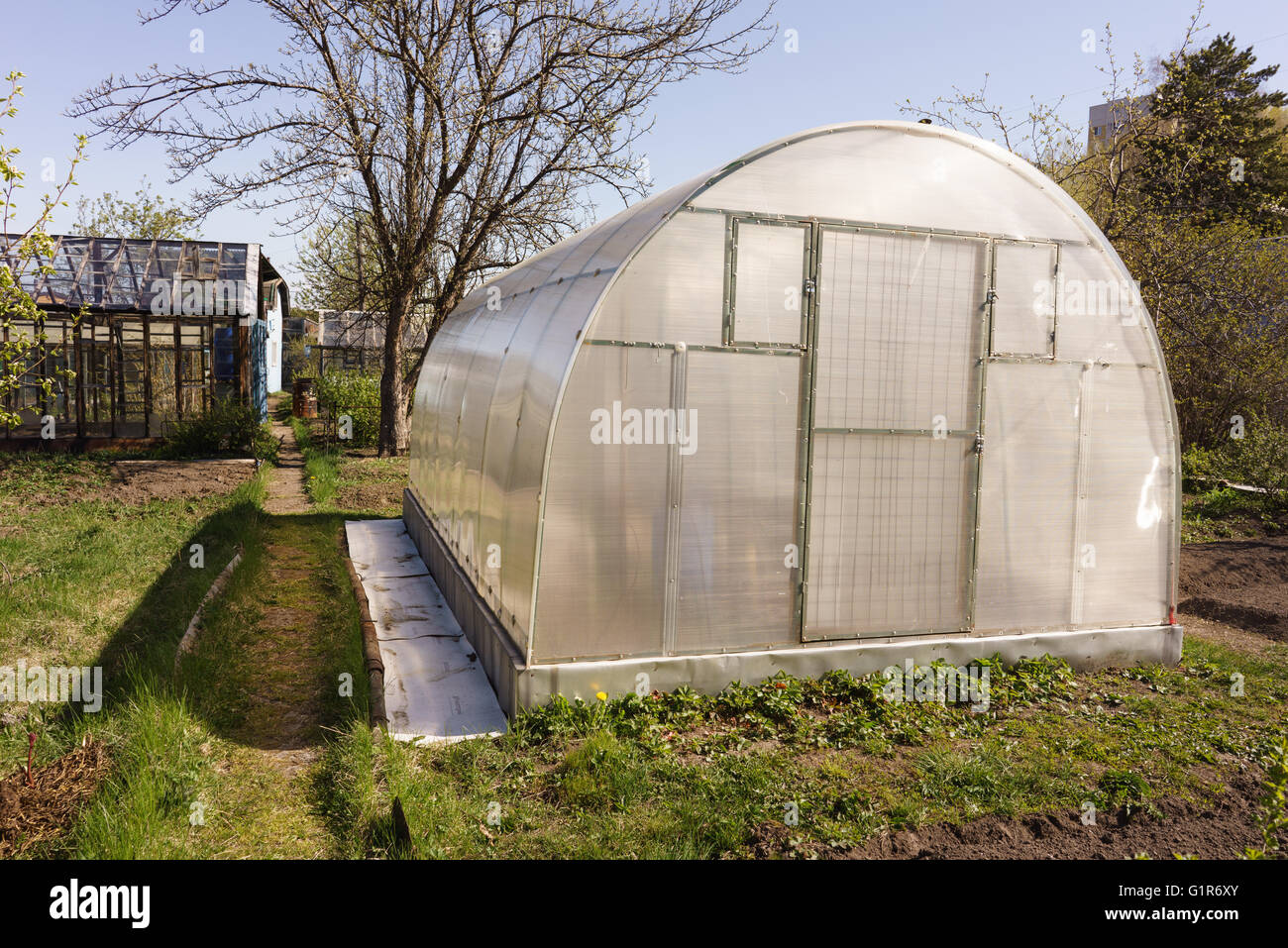 A small greenhouse with air vents in the garden Stock Photo Alamy
