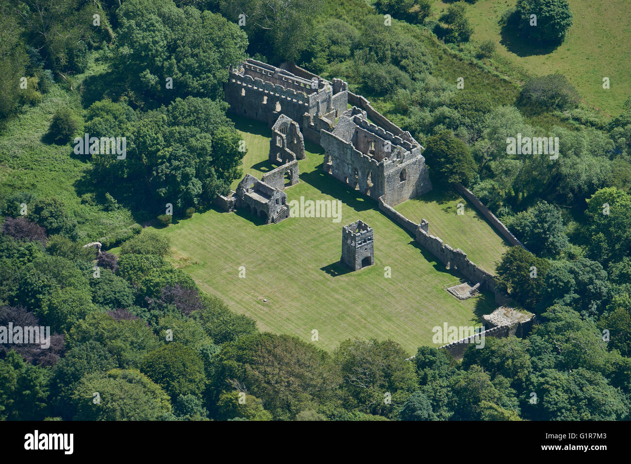 An aerial view of the ruins of the Bishops Palace in the Pembrokeshire village of Lamphey Stock Photo