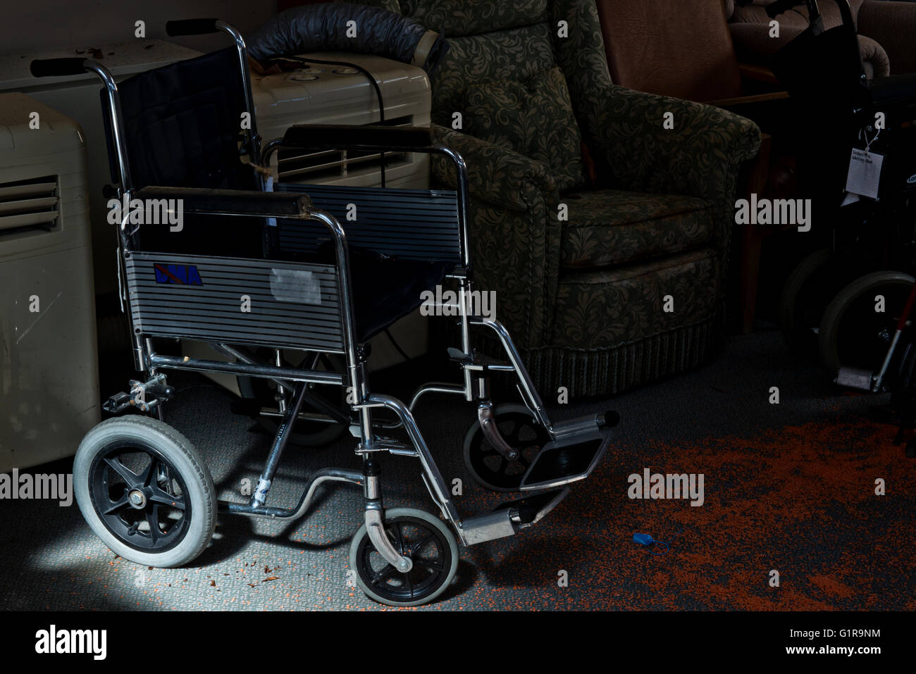 Wheelchair left behind after the closure of Linford Park Nursing Home, Hampshire, UK Stock Photo